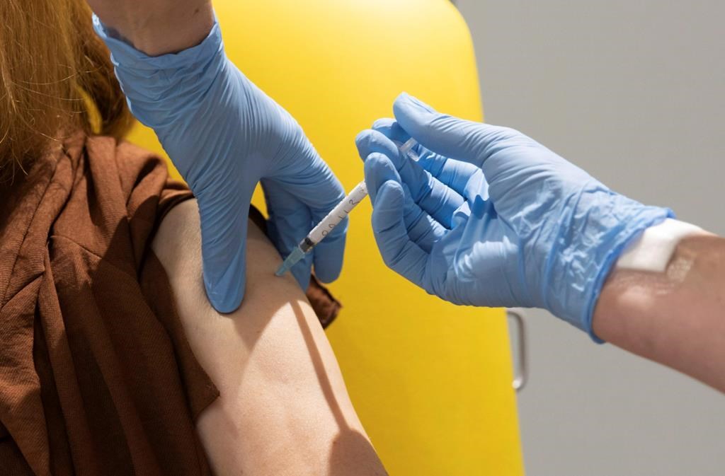 In this handout photo released by the University of Oxford a volunteer participates in the vaccine trial in Oxford, England on July 7, 2020.