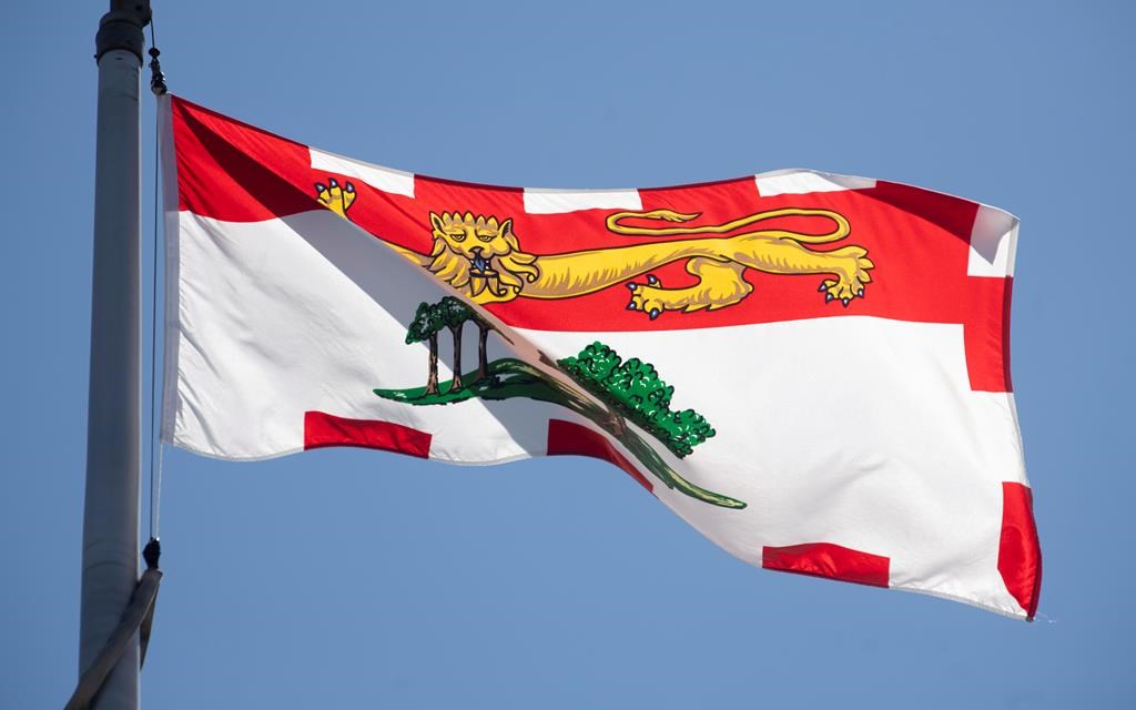 Prince Edward Island's provincial flag flies on a flag pole in Ottawa, Monday, July 6, 2020. Health officials in Prince Edward Island say there are now no active cases of COVID-19 in the province. THE CANADIAN PRESS/Adrian Wyld.