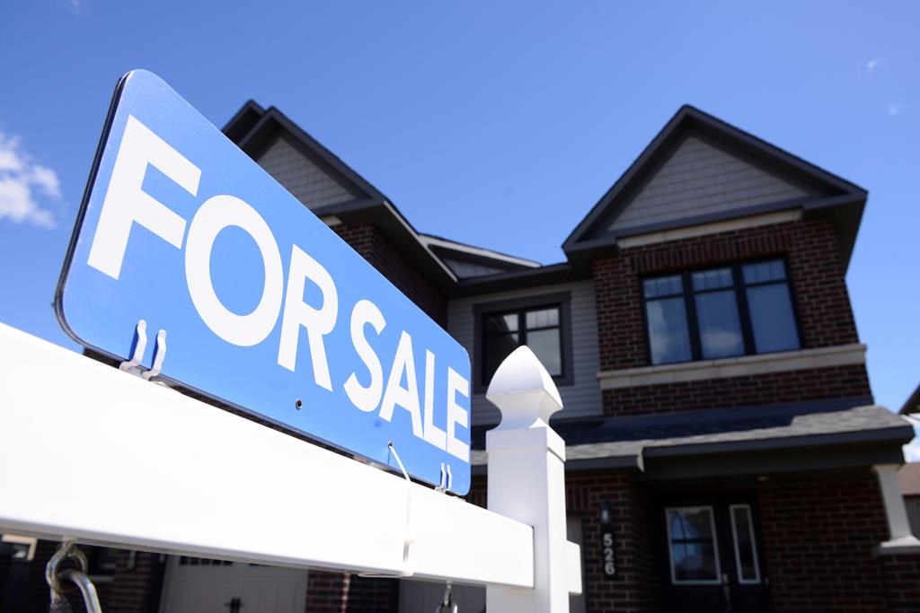 A new home is displayed for sale in a housing development in Ottawa on Tuesday, July 14, 2020.