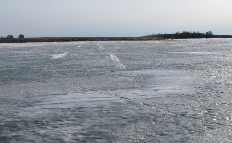 Skid marks on a frozen lake where a plane was forced to make an emergency landing near Gillam, Manitoba in April, 2019.