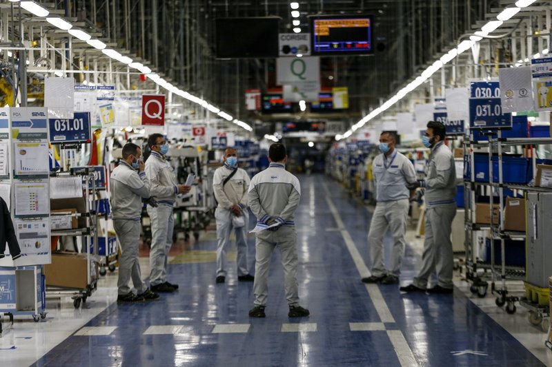 FILE - Managers inform small groups of workers about new safety devices and measures taken at the Fiat Chrysler Automobiles plants of Atessa, in Central Italy, in a Monday, April 27, 2020 file photo. General Motors is asking a federal judge to reconsider dismissal of a lawsuit against Fiat Chrysler based on new allegations that FCA bribed union and GM officials with millions stashed in secret foreign bank accounts. The allegations were made in a court motion filed Monday, Aug. 3, 2020 by GM. 