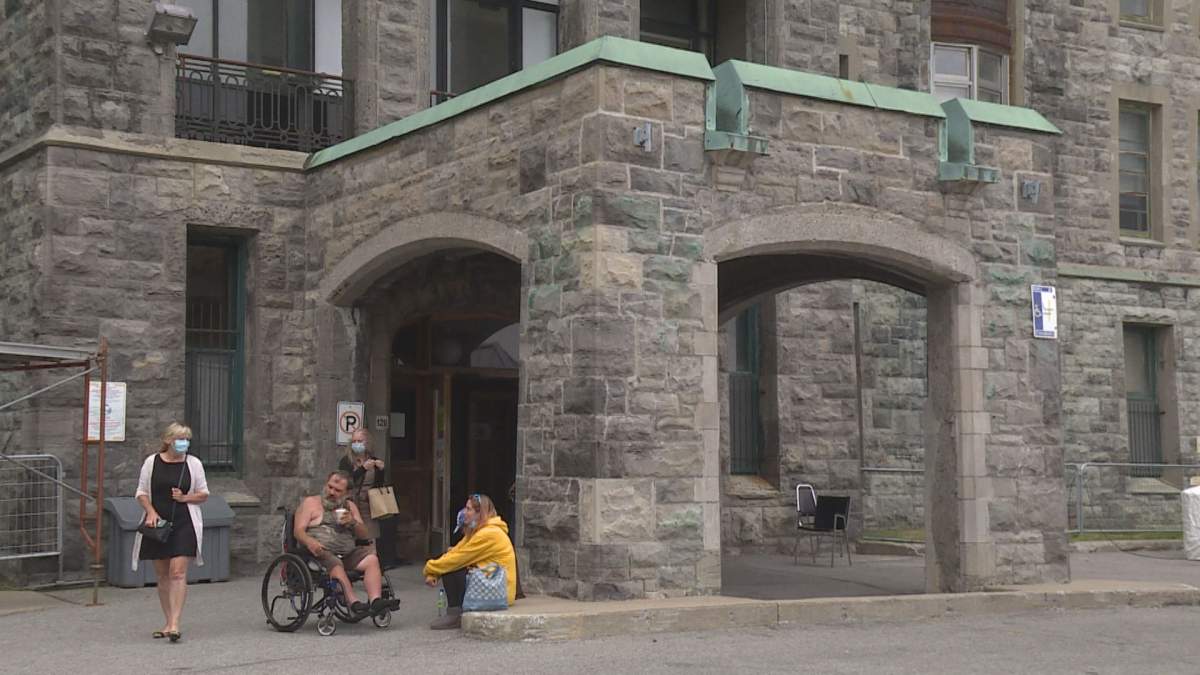 The old Royal Victoria Hospital has become a 24/7 homeless shelter. It was expected to house the city's first supervised alcohol consumption site.