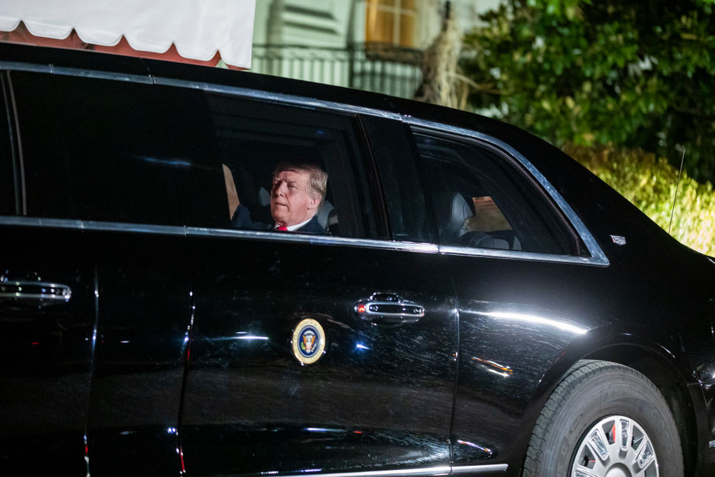 U.S. President Donald Trump sits in the presidential limo as he departs the White House for Capitol Hill, where he will deliver his second State of the Union speech, on Feb. 5, 2019.