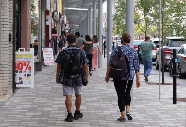 Pedestrians walk alongside the north section of Plaza Saint-Hubert, between Saint-Zotique to Jean Talon Street, where roadwork is complete and sidewalks are renovated on Tuesday, Aug. 11, 2020.