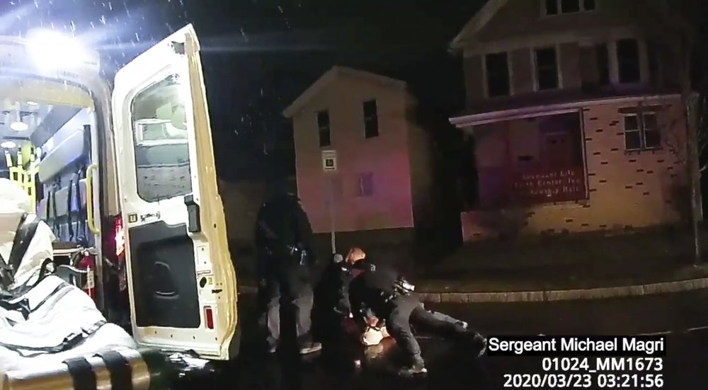 In this image taken from police body camera video provided by Roth and Roth LLP, Rochester police officers hold down Daniel Prude on March 23, 2020, in Rochester, N.Y.