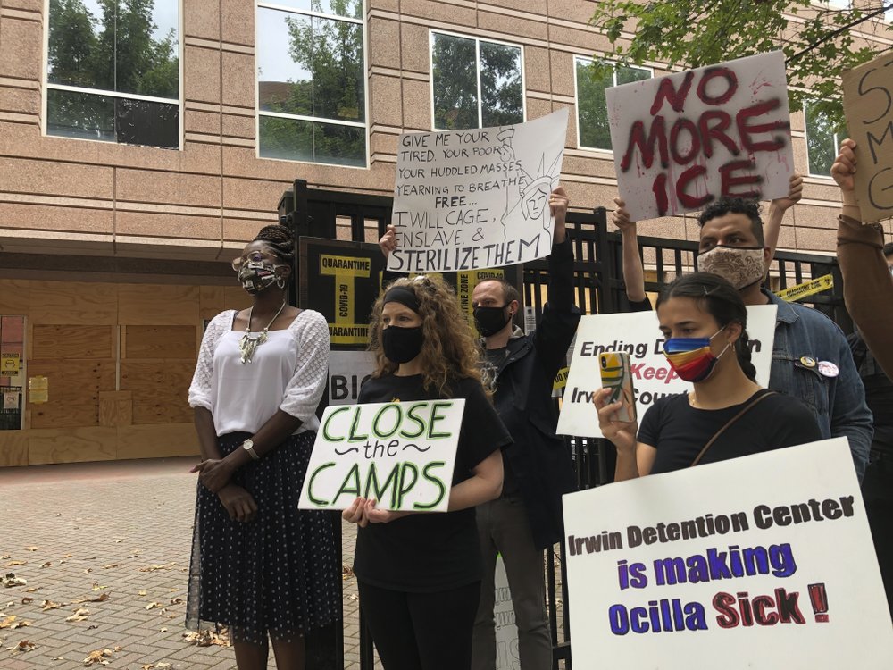 FILE - In this Tuesday, Sept. 15, 2020, file photo, Dawn Wooten, left, a nurse at Irwin County Detention Center in Ocilla, Georgia, speaks at a news conference in Atlanta protesting conditions at the immigration jail. An Associated Press review of medical records for four detained immigrant women at the detention center and interviews with lawyers have revealed growing allegations that a gynecologist performed surgeries that the women never sought or didn’t fully understand. 