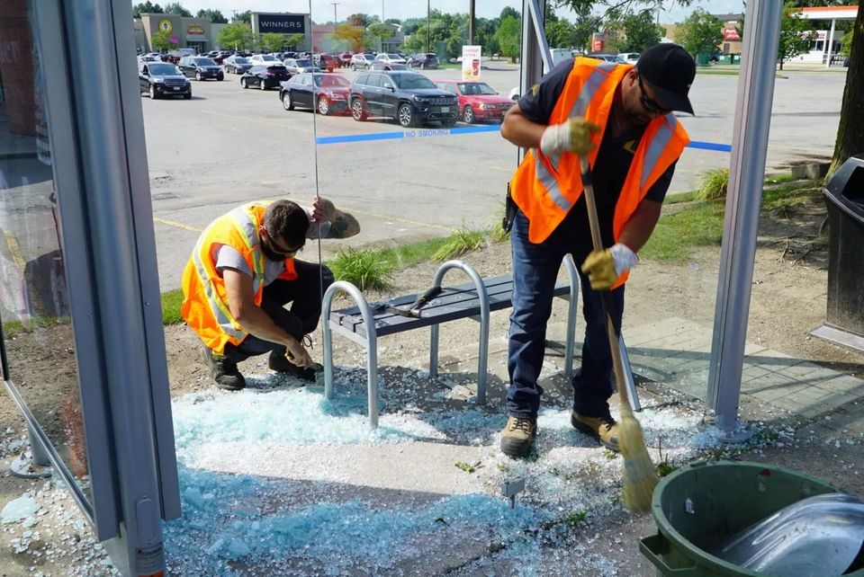 Vandalized bus shelter in London. 