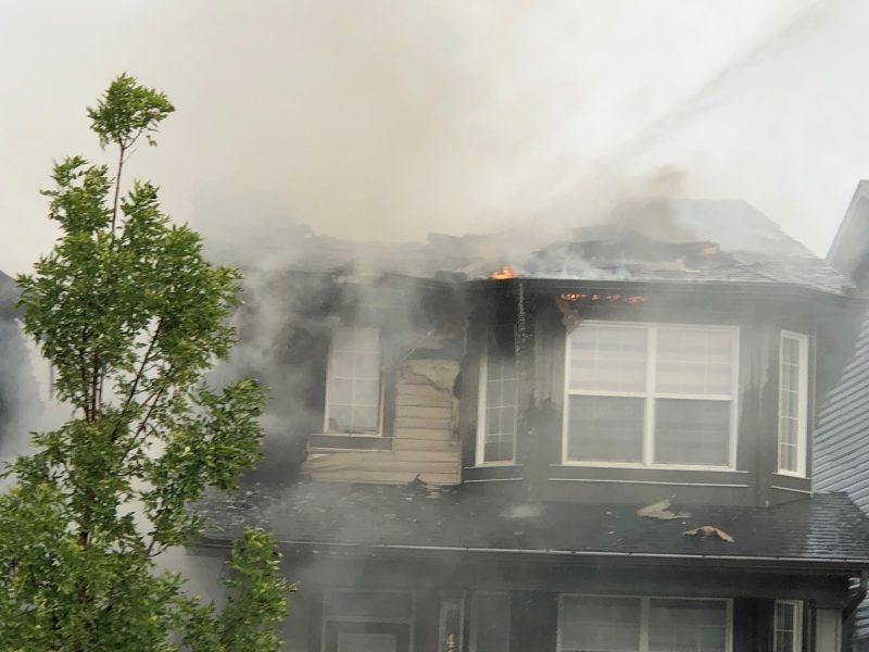 Calgary firefighters battle a house fire in the 400 block of Evanston Drive Northwest on Tuesday, Sept. 8, 2020.