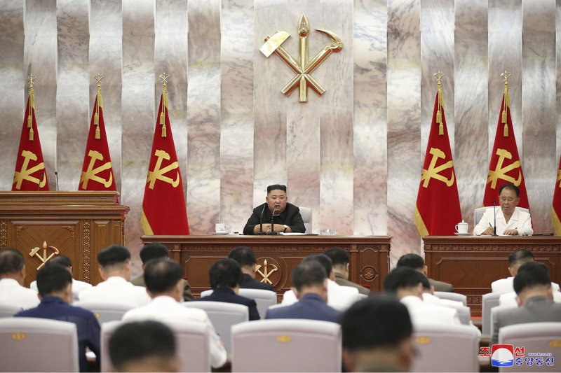 In this photo provided by the North Korean government, North Korea leader Kim Jong Un speaks during a Workers’ Party meeting in Pyongyang, North Korea, Tuesday, Sept. 8, 2020. Kim during the high-level political conference called for urgent efforts to rebuild thousands of homes and other structures destroyed by Typhoon Maysak that slammed the country’s eastern region last week, state media said Wednesday, Sept. 9. Independent journalists were not given access to cover the event depicted in this image distributed by the North Korean government. The content of this image is as provided and cannot be independently verified. Korean language watermark on image as provided by source reads: "KCNA" which is the abbreviation for Korean Central News Agency. 