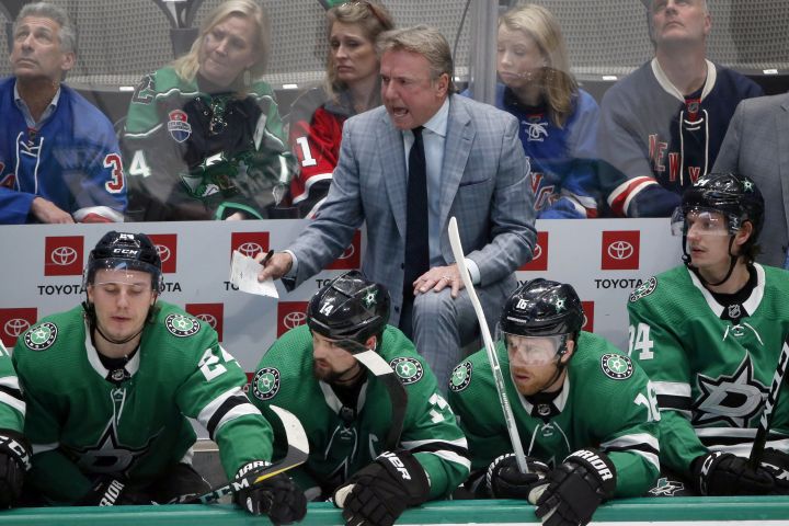 In this March 10, 2020, file photo, Dallas Stars interim head coach Rick Bowness yells from the bench as they played the New York Rangers during the third period of an NHL hockey game in Dallas. 