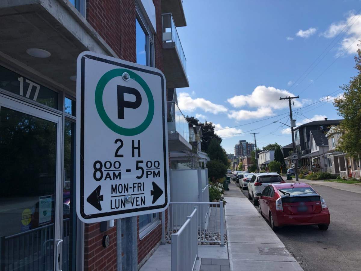 A street parking sign in Ottawa's Hintonburg neighbourhood.