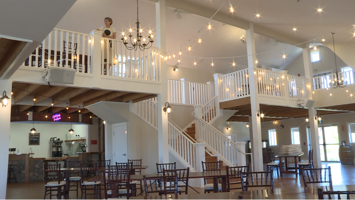 Lori Neufeld looks over the inside of her barn at Whitetail Meadow, a wedding venue south of Winnipeg.
