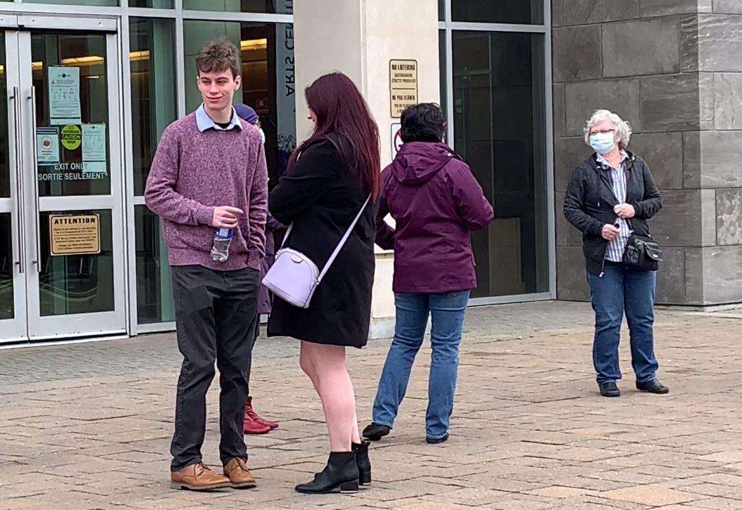 Jordan talks to Sarah Taylor outside the courthouse after her testimony.