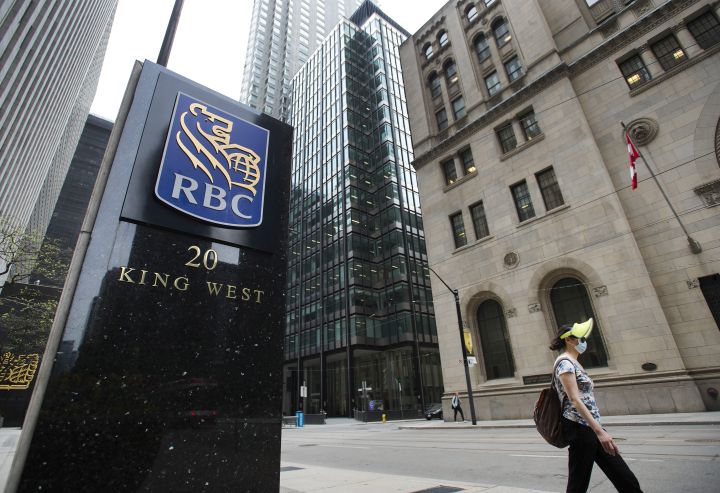 A person walks by the Royal Bank of Canada building on Bay Street during the COVID-19 Pandemic in Toronto on Wednesday, May 27, 2020. 