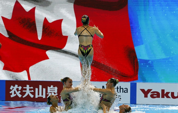 In this July 16, 2019 file photo, members of team Canada perform during  the FINA Swimming World Championships 2019 at the Yeomju gym in Gwangju, South Korea. Canada's artistic swim team has halted training at it's Montreal facility after complaints from athletes. Thursday, Oct. 1, 2020.