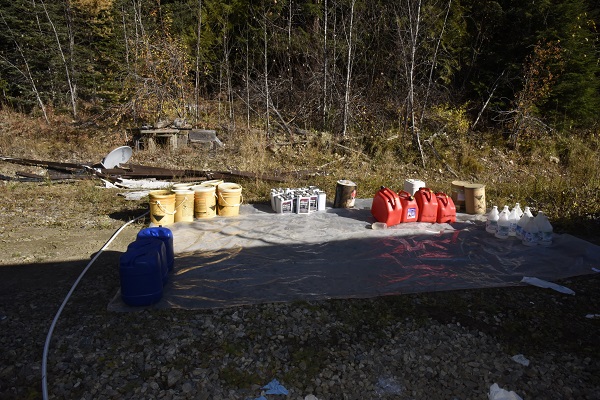 Various chemical containers laid out for collection and disposal.