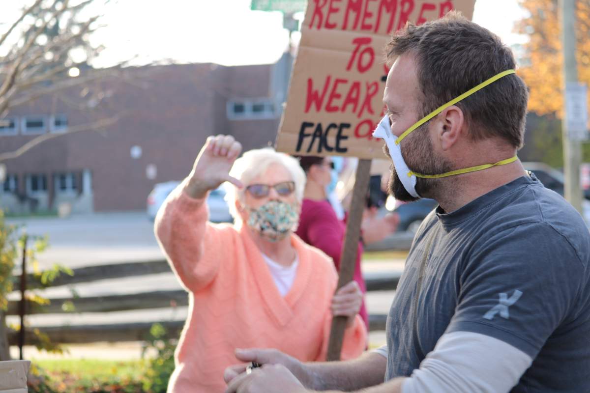 Aylmer Ont. residents opposed to the demonstration lined the streets with some heated moments between residents who did not want the anti-mask rally in their town. Nov. 7, 2020