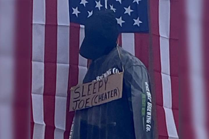 A mannequin is shown hanging from a Trump supporter’s home in Brentwood, Calif., with an insult for Joe Biden written on the sign around its neck on Nov. 5, 2020.