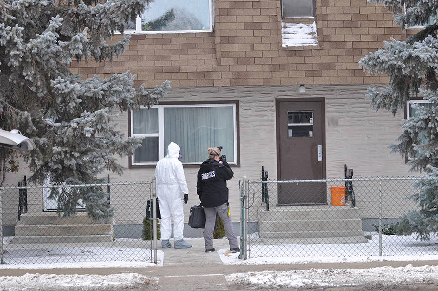 Police outside Bud Paul's residence.
