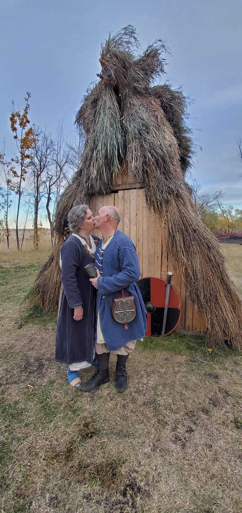 Pedro Bedard and his wife Wendy Speary in front of their hut.