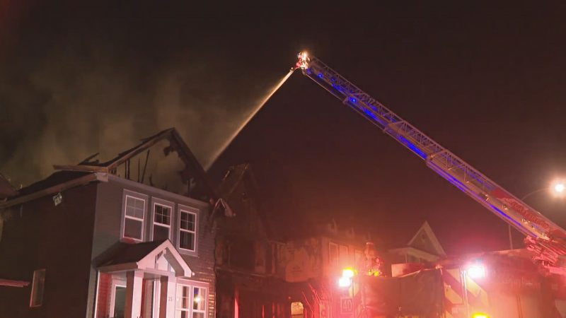 Calgary firefighters battle a blaze in Nolan Hill on Thursday, Dec. 3, 2020.