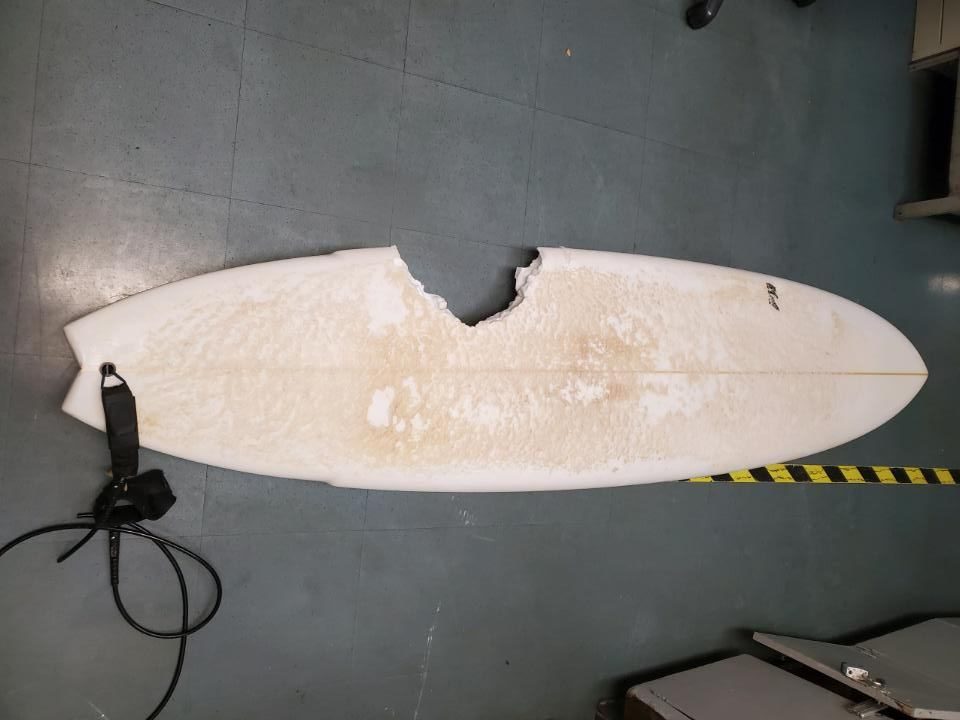 A victim’s surfboard is shown following a shark attack in Hawaii on Dec. 8, 2020.