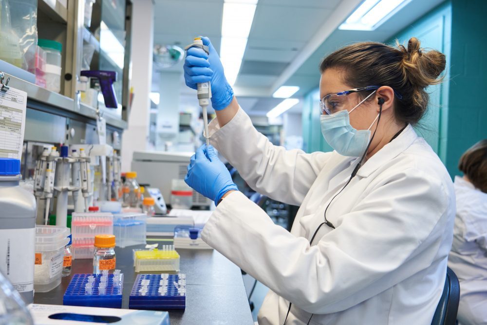 A Medicago employee works on the company’s COVID-19 vaccine candidate.