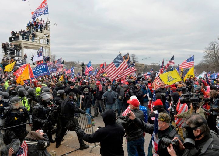 Trump supporters clash with police and security forces as they try to storm the U.S. Capitol in Washington, D.C. on January 6, 2021.