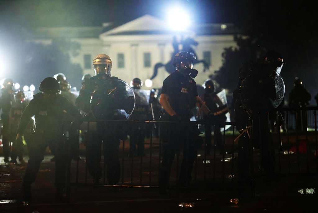 Police officers hold a perimeter during a protest near the White House in response to the killing of George Floyd on May 31, 2020, in Washington, D.C.