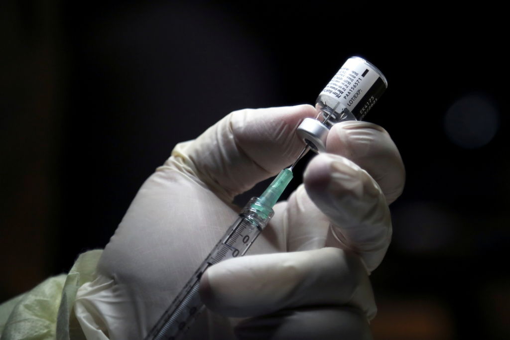 FILE-A health-care worker prepares to administer a Pfizer/BioNTEch coronavirus disease (COVID-19) vaccine at The Michener Institute, in Toronto on Dec. 14, 2020.