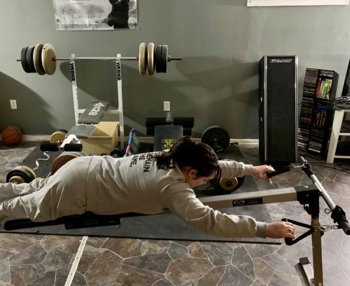 Krystal Shaw, 27, trains at home on her swim bench.