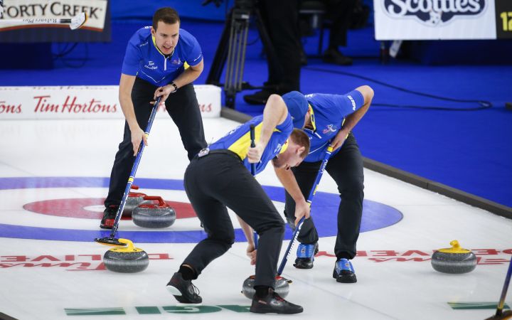 Team Alberta skip Brendan Bottcher, left, directs his team as he plays Team Wild Card Three at the Brier in Calgary, Alta., Monday, March 8, 2021.