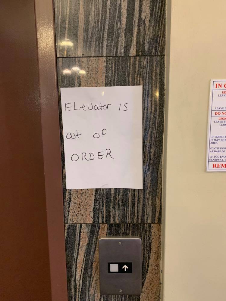An ‘out-of-order’ sign is seen at the 16 Caxton Close apartment building in Halifax.