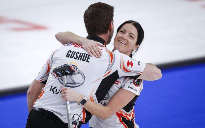 Team Einarson/Gushue skip Kerri Einarson, right, and third Brad Gushue celebrate defeating Team Schmiemann/Morris in the semi-final at the Canadian Mixed Doubles Curling Championship in Calgary, Alta., Thursday, March 25, 2021.