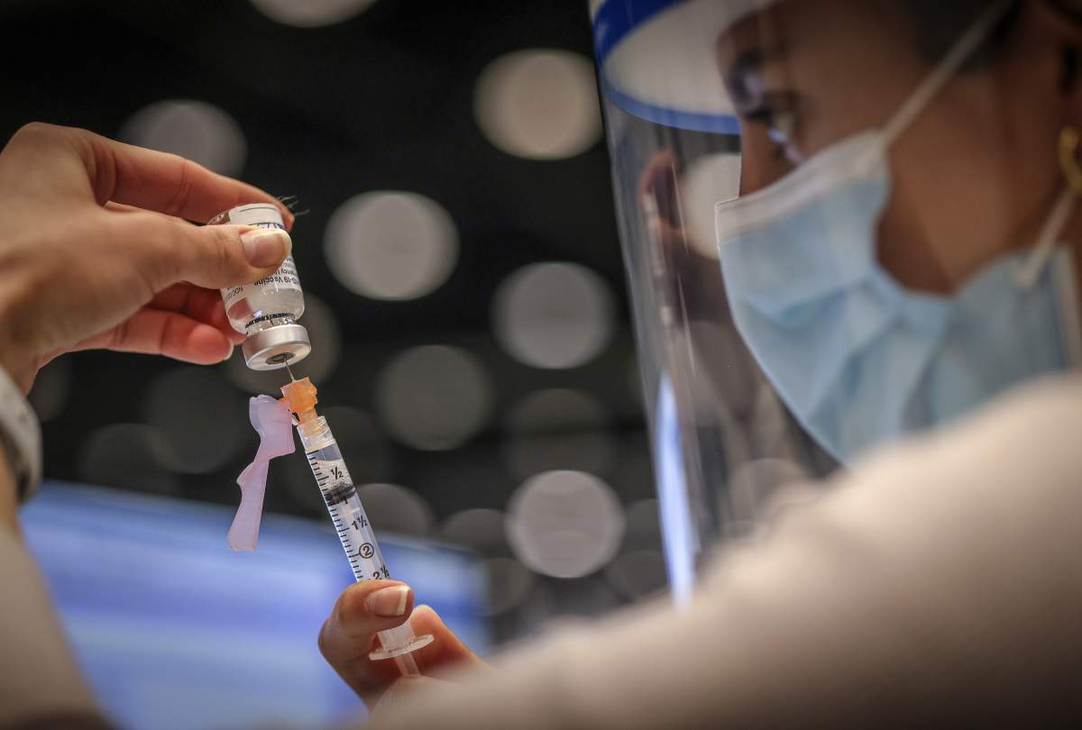 The AstraZeneca/Covishield vaccine is drawn at the Telus Convention Centre immunization site in Calgary on April 20, 2021.