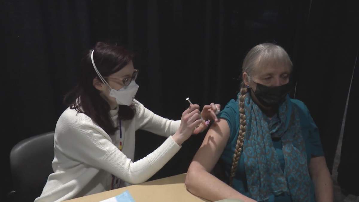 A person gets their COVID-19 shot at Calgary’s second Indigenous vaccine clinic.