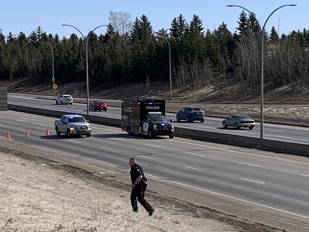 A major collision involving a police officer shut down a section of Whitemud Drive near 91 Street in southeast Edmonton on Monday, April 5, 2021.