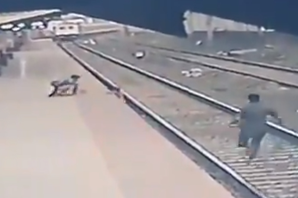 A boy is shown on the tracks at Vangani station in Mumbai on April 17, 2021, in this image from CCTV video.