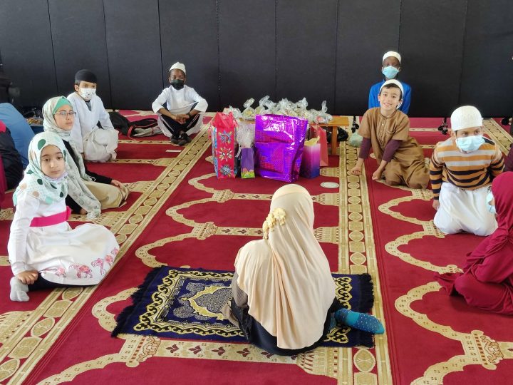 Children receive gifts ahead of Eid at Mosquee Madani in Montreal.