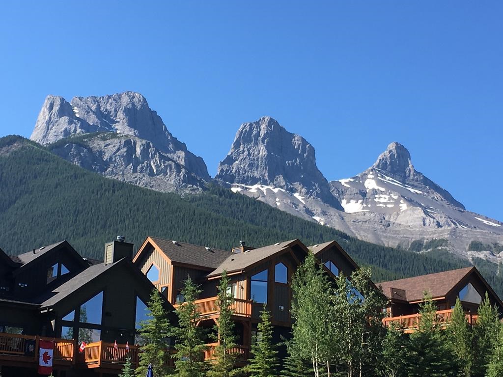 A housing development near the Three Sisters mountains on the eastern edge of Canmore, Alta. is shown on July 2, 2017.