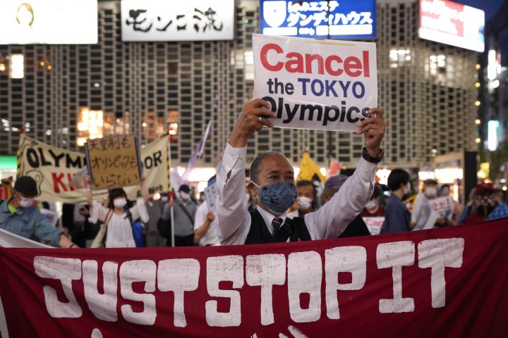 TOKYO, JAPAN: Protesters hold up a banner that reads, “Just Stop it” during an anti-Tokyo 2020 Olympic Games Rally in Ginza district on May 17, 2021