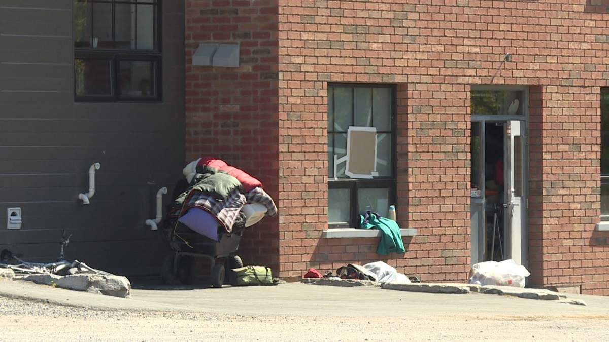 Integrated care hub and a shopping cart filled with a homeless person's items.