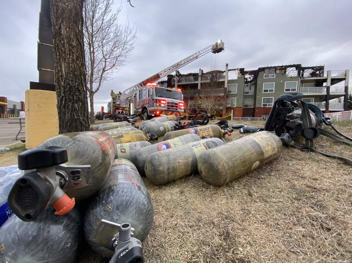 Fire crews remained on scene Friday, May 7, 2021 one morning after a massive fire tore through the Citadel Mews West Continuing Care Facility in St. Albert, Alta.