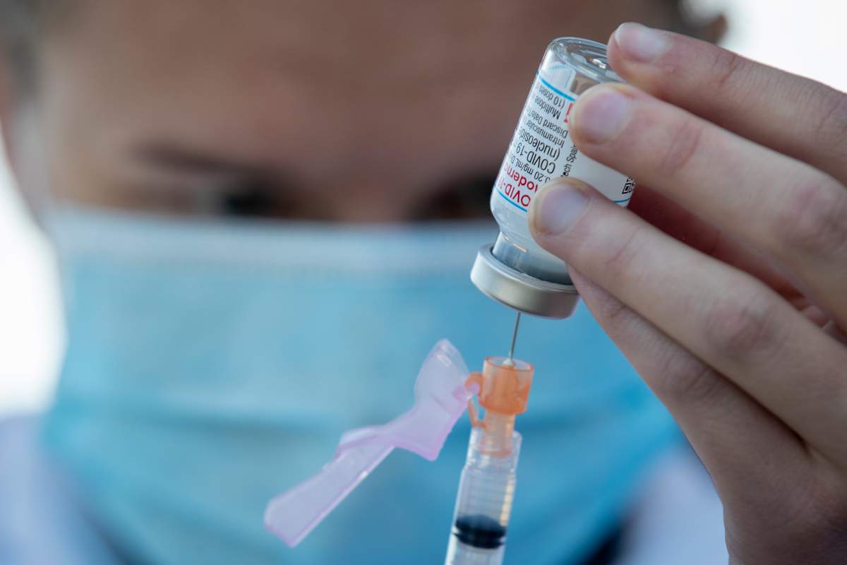 Moderna COVID-19 vaccine is drawn out from a vial before a drive-thru vaccine clinic in Kingston, Ontario on Friday June 4, 2021.