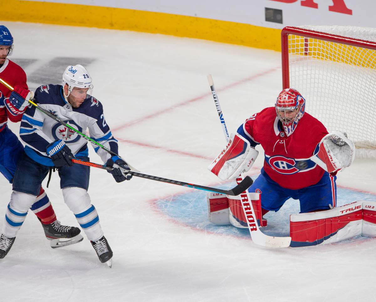 Montreal Canadiens goaltender Carey Price (31) keeps his eye on the puck as he stops Winnipeg Jets Paul Stastny (25) during first period NHL Stanley Cup playoff hockey action in Montreal, Sunday, June 6, 2021.