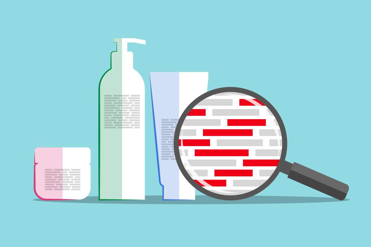 Different cosmetics and magnifier above info about chemical composition. 