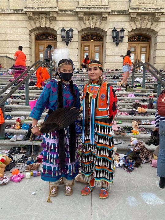 Meadow Musqua (left) danced at the Saskatchewan Legislative Building during a ceremony honouring the remains of 215 children found at a former Kamloops residential school.
