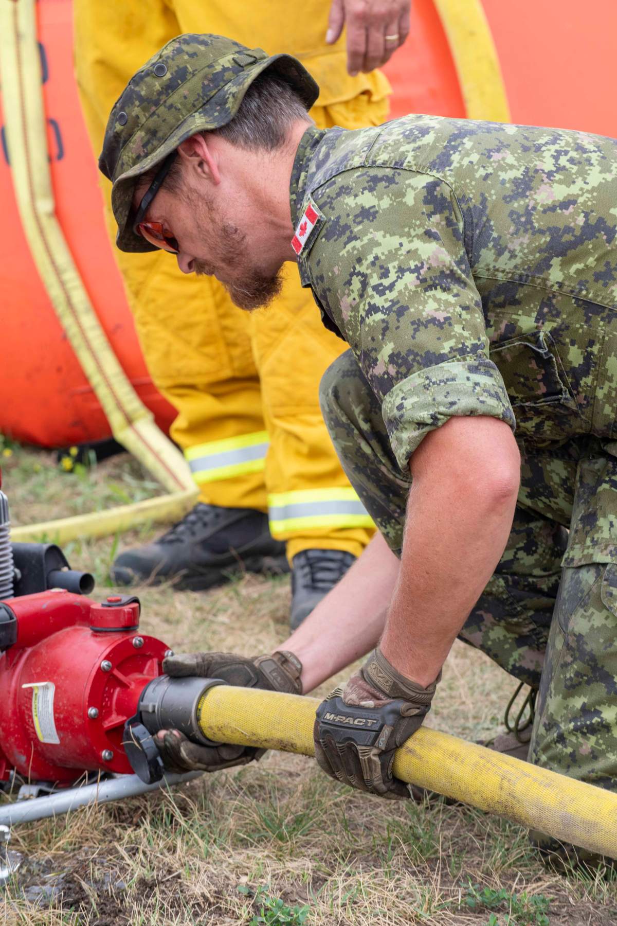 Master Corporal Kevin Foley, 2nd Battalion, Princess Patricia’s Canadian Light Infantry learns fire safety and how to properly operate the equipment, as part training in July 2021.
