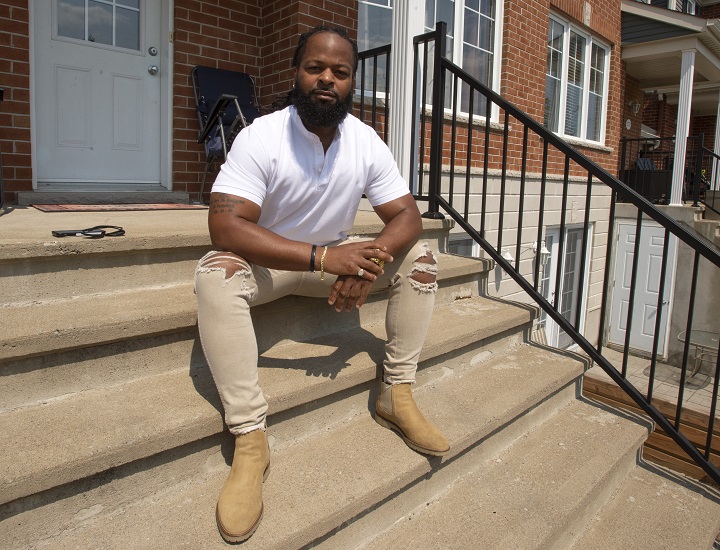 Leslie Blot, who has won another successful racial profiling complaint against the city of Repentigny, is seen in front of his home Monday, July 5, 2021 in Mascouche, Que. 