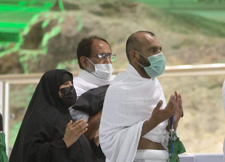 Muslim pilgrims pray in front of Al-Safa mountain at the Grand Mosque, a day before the annual hajj pilgrimage, Saturday, July 17, 2021.